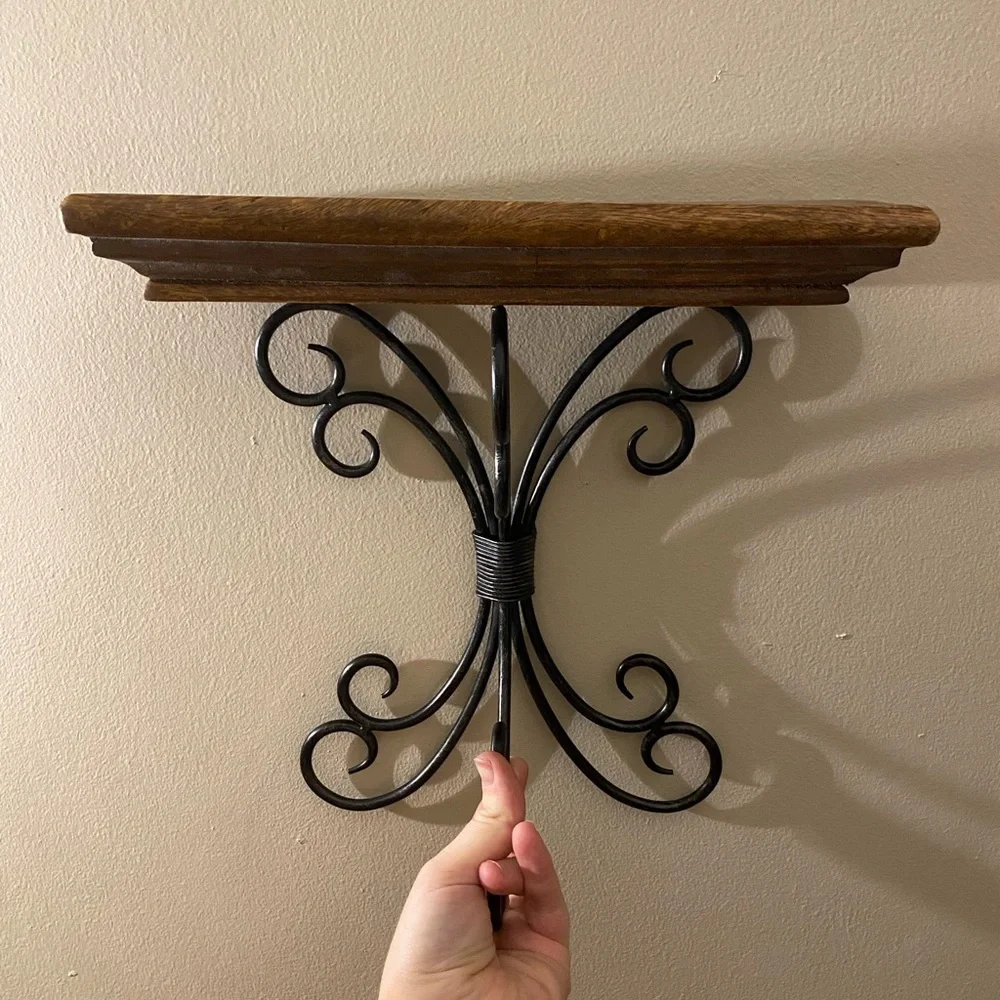Brown and black iron and wood wall shelf